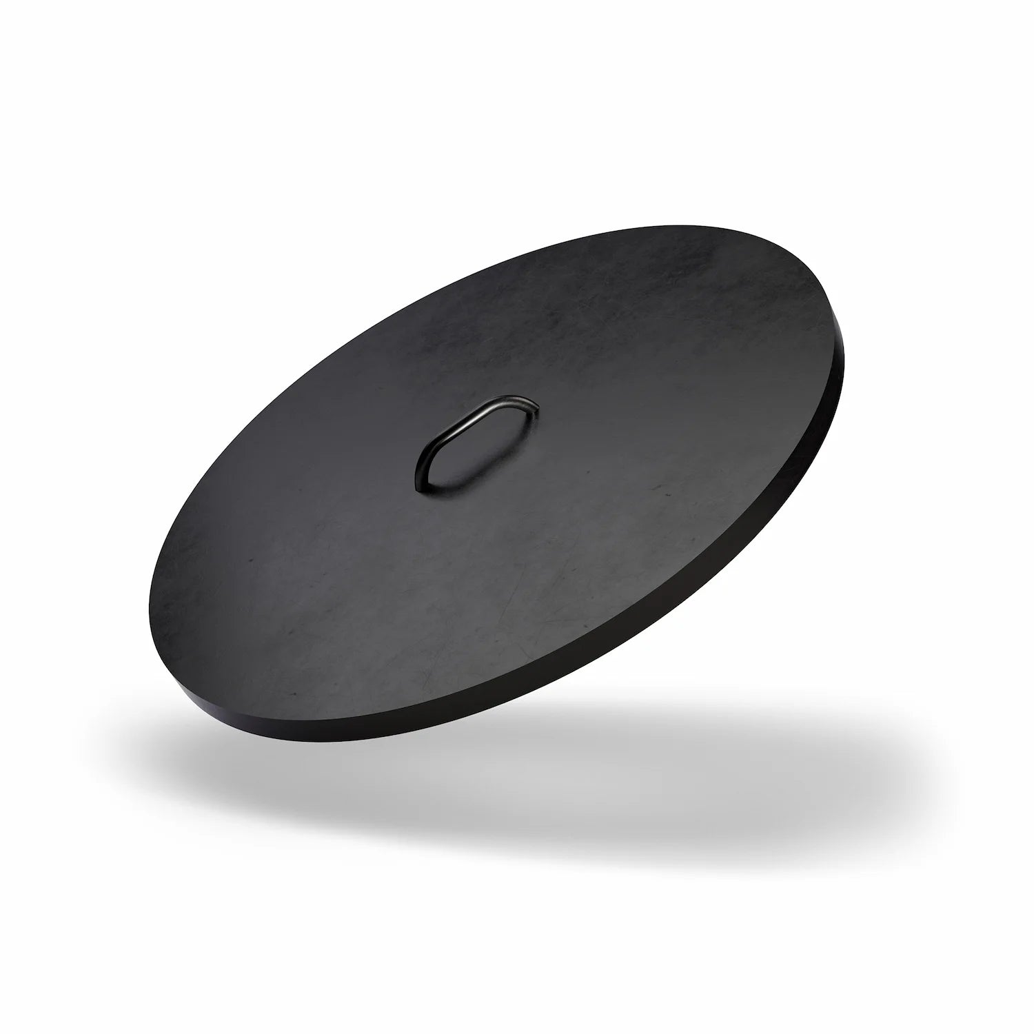 Vuuris protective steel lid in matte black powder-coated finish placed on the Vuuris fire pit to shield the cooking plate from rain and snow