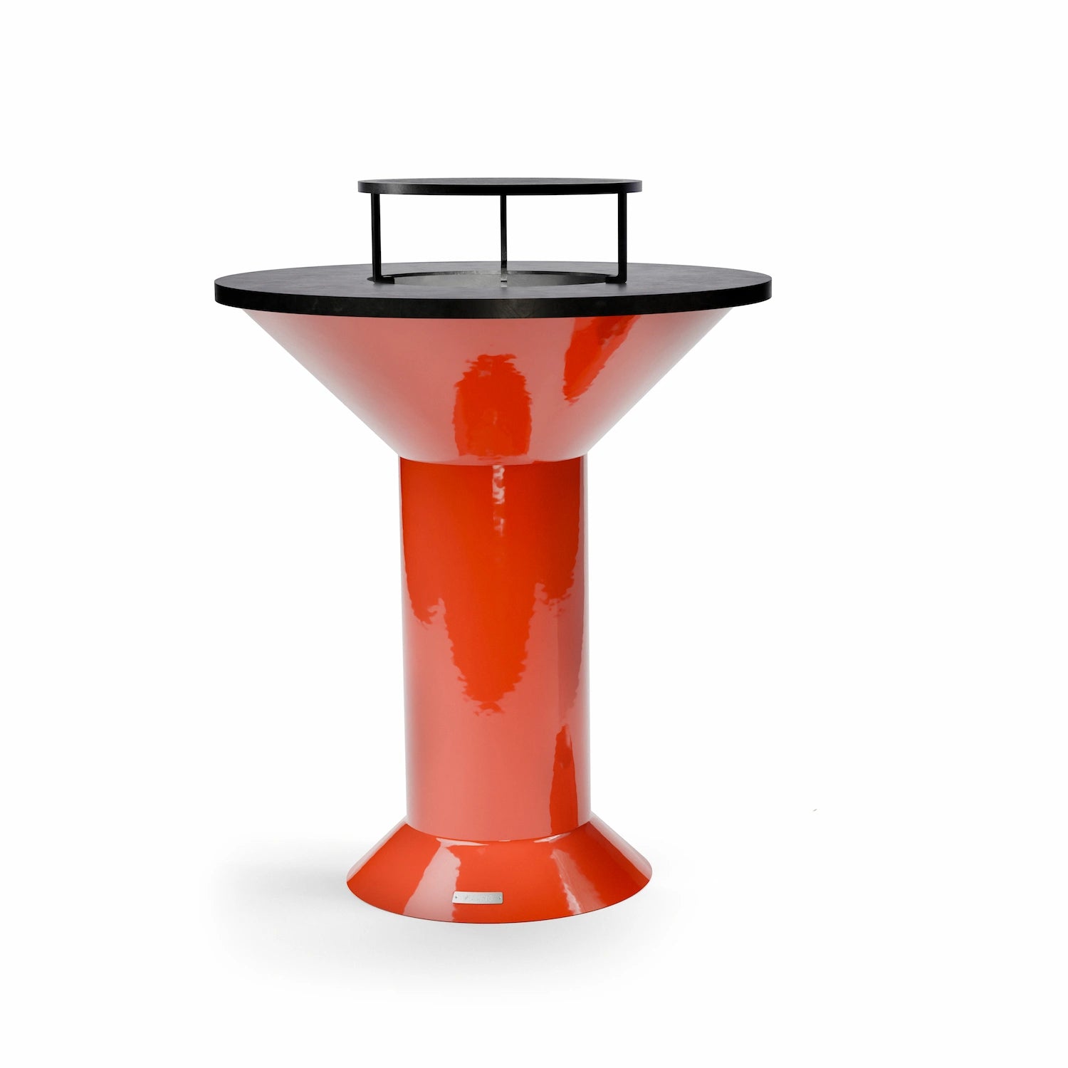 A carbon steel grill with three feet over the opening of an orange Vuuris grill barbecue