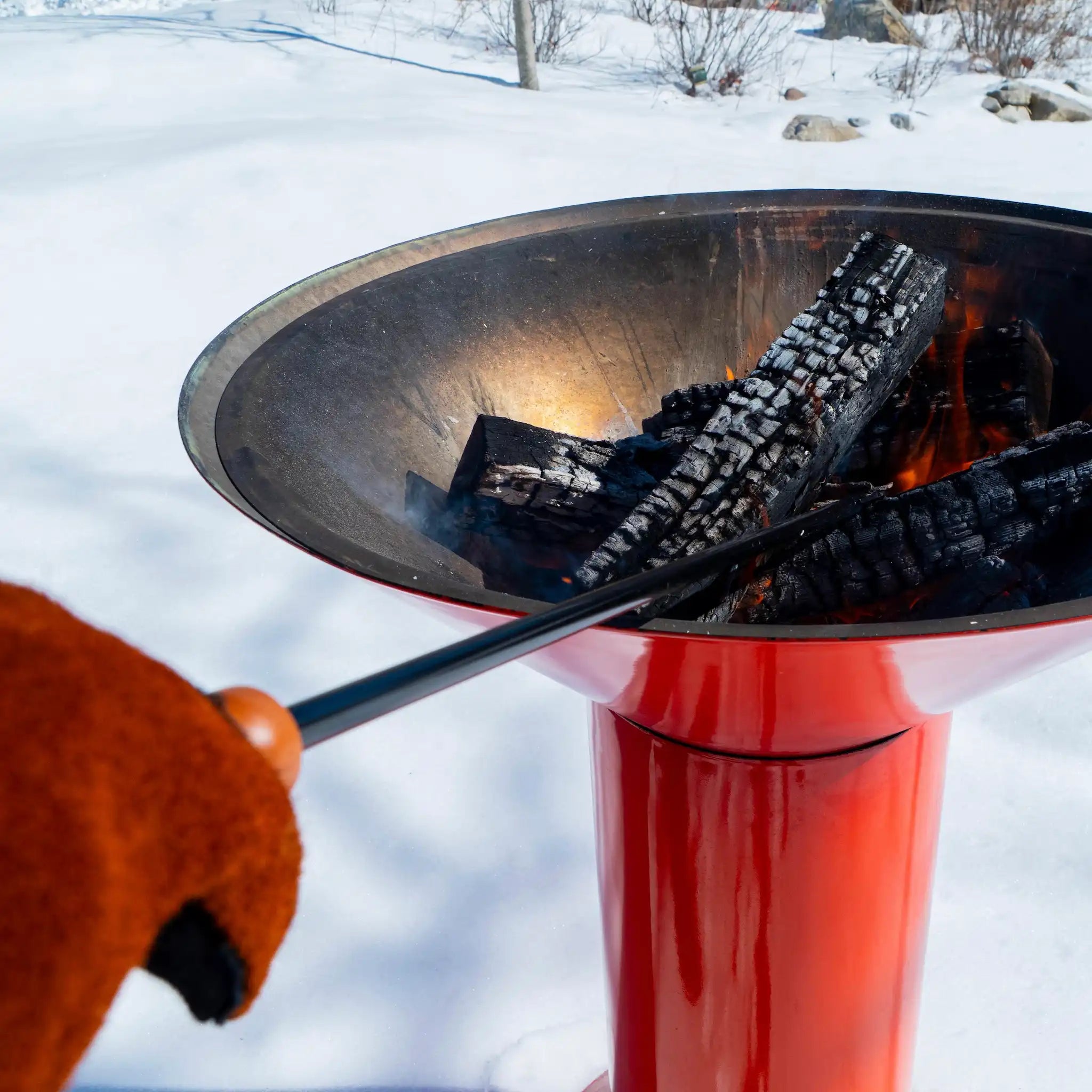 a close up of the blow poke stoking the fire of the orange Vuuris Tiger