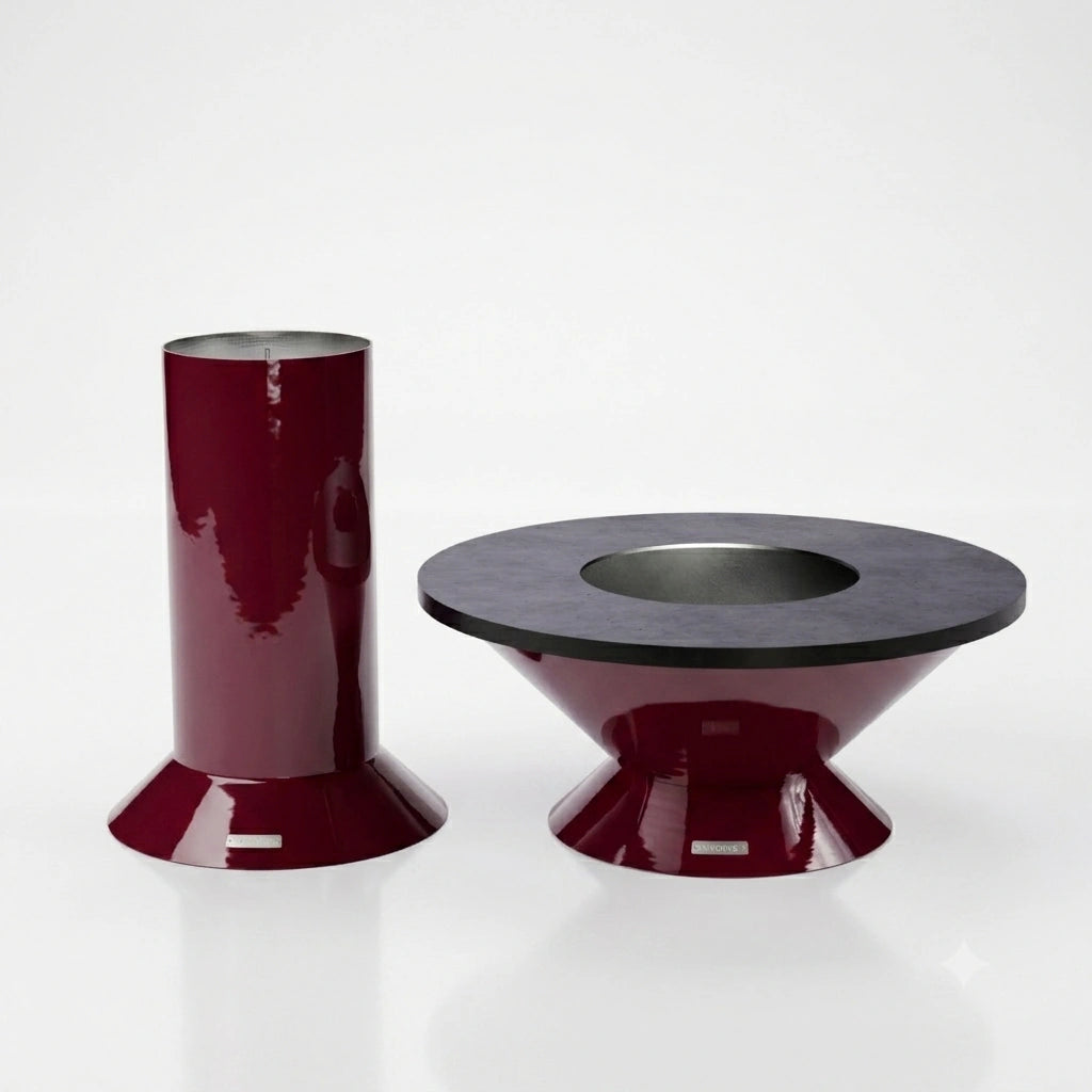 Vuuris Garnet fire pit with small base and carbon steel cooking plate, shown alongside the large base, illustrating both modular height options in bordeaux porcelain enamel
