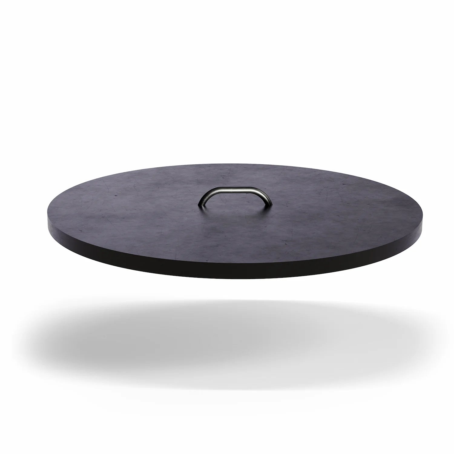 Vuuris protective steel lid in matte black powder-coated finish placed on the Vuuris fire pit to shield the cooking plate from rain and snow