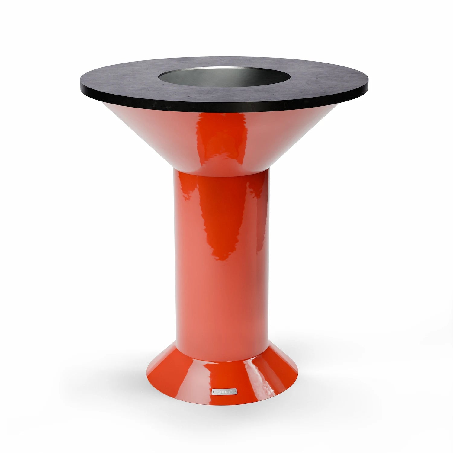 Vuuris Tiger outdoor fire pit centerpiece in vibrant orange porcelain enamel, mounted on the large base at counter height with the 8mm carbon steel cooking plate